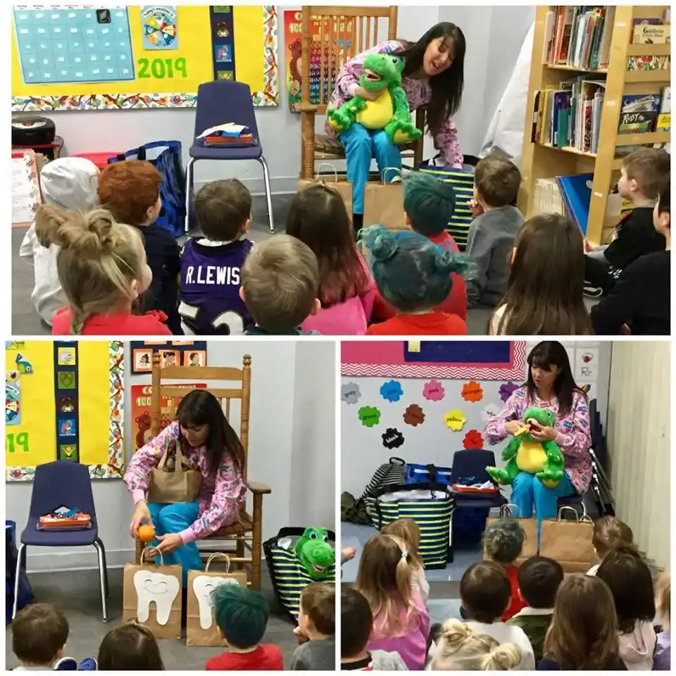 Instructor explaining structure of teeth to young children in Bay Country- A Pre school in Annapolis Maryland