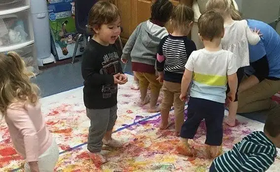 Young children doing painting activity at Bay Country-Early learning center Annapolis MD